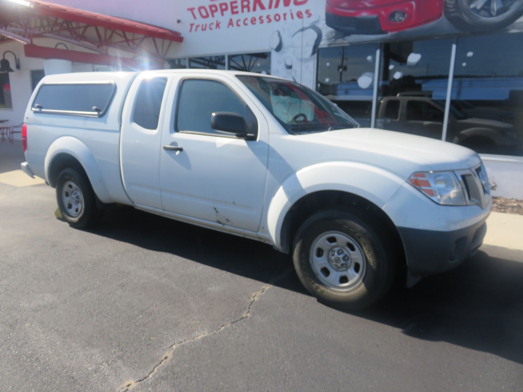 2019 Nissan Frontier with Ranch Sierra Fiberglass Topper, Windoor, Tint, Hitch by TopperKING in Brandon 813-689-2449 or Clearwater FL 727-530-9066. Call Us!