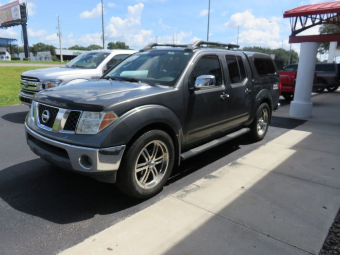 2006 Nissan Frontier with Ranch Sierra Fiberglass Topper, Nerf Bars, Bug Guard, Tint. Call TopperKING in Brandon 813-689-2449 or Clearwater FL 727-530-9066.
