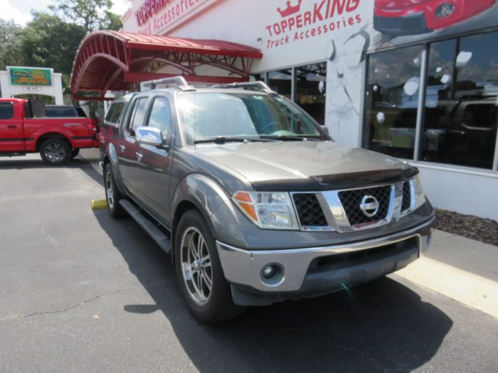 2006 Nissan Frontier with Ranch Sierra Fiberglass Topper, Nerf Bars, Bug Guard, Tint. Call TopperKING in Brandon 813-689-2449 or Clearwater FL 727-530-9066.