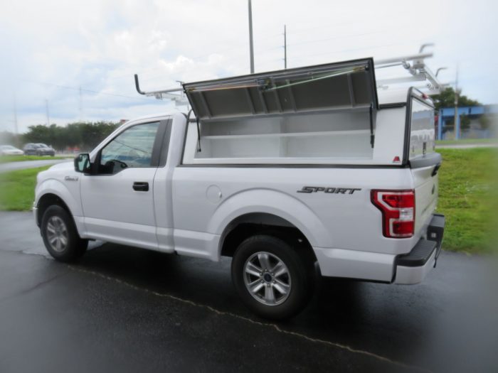 2019 Ford F150 with LEER DCC Commercial Topper, Roof Racks, Decked, and Hitch by TopperKING Brandon 813-689-2449 or Clearwater, FL 727-530-9066. Call Today!