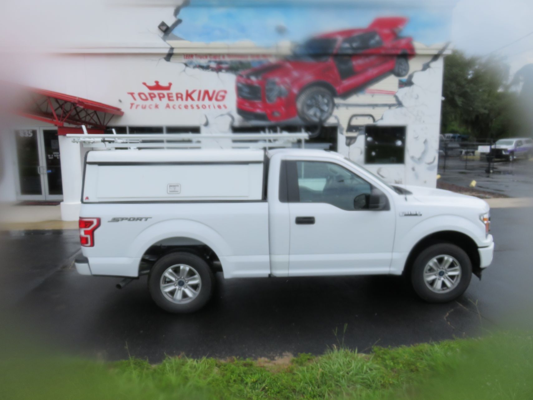 2019 Ford F150 with LEER DCC Commercial Topper, Roof Racks, Decked, and Hitch by TopperKING Brandon 813-689-2449 or Clearwater, FL 727-530-9066. Call Today!