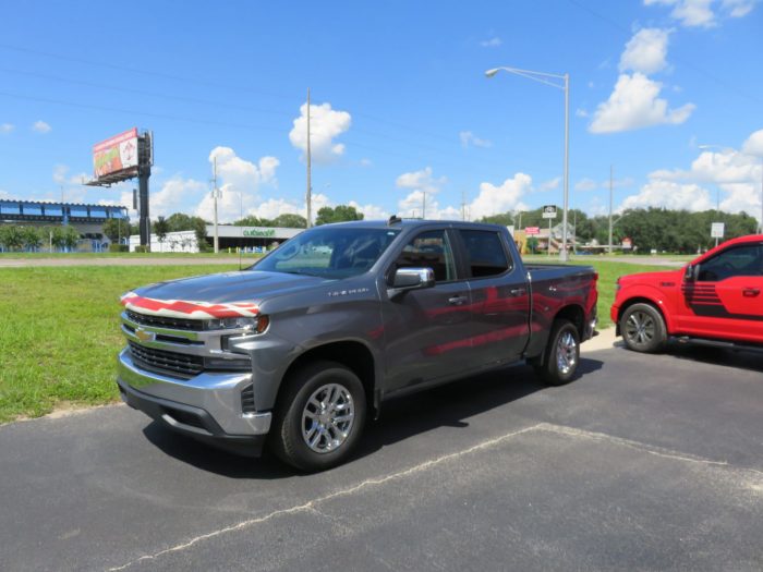 2020 Chevy Silverado with American Flag Hood Guard, Bedliner, Tint, Hitch. Call TopperKING Brandon 813-689-2449 or Clearwater FL 727-530-9066!