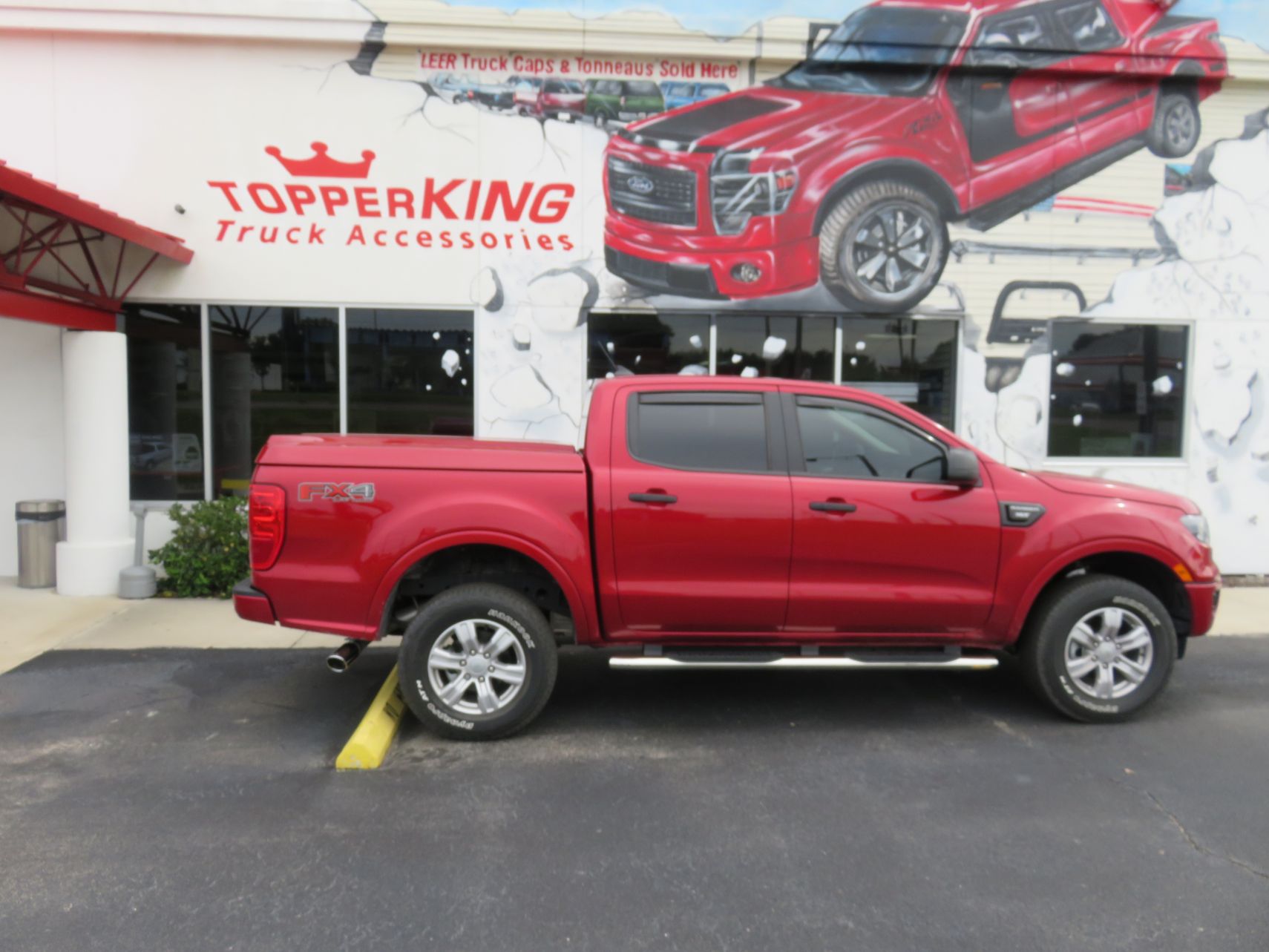 2020 Ford Ranger with LEER 700 Fiberglass Lid, Vent Visors, Nerf Bars, Tint, Hitch. Call TopperKING in Brandon 813-689-2449 or Clearwater, FL 727-530-9066.