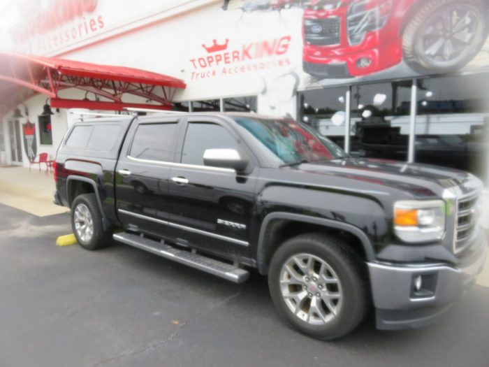 2018 GMC Sierra with TK Defender, Roof Racks, Vent Visors, Side Steps. Call TopperKING Brandon 813-689-2449 or Clearwater 727-530-9066.