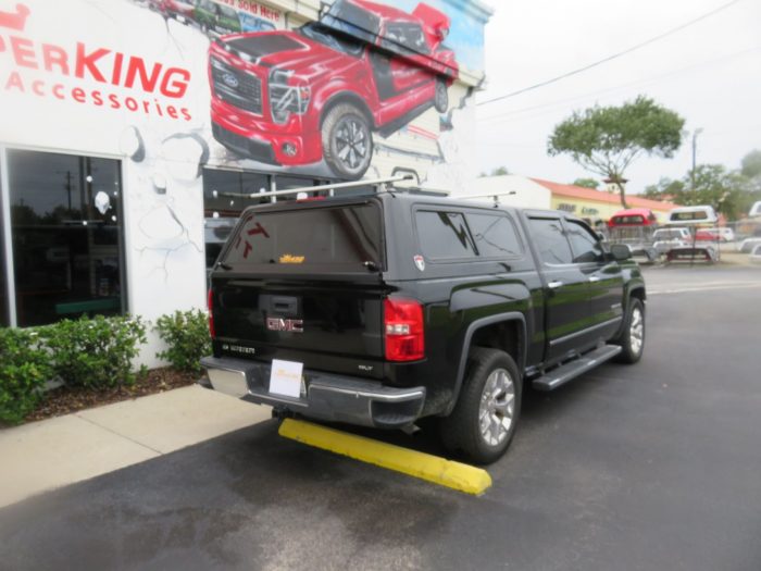 2018 GMC Sierra with TK Defender, Roof Racks, Vent Visors, Side Steps. Call TopperKING Brandon 813-689-2449 or Clearwater 727-530-9066.