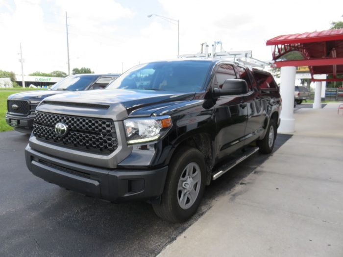 2018 Toyota Tundra with LEER 100RCC, Roof Racks, Side Access, Nerf Bars, Hitch by TopperKING Brandon 813-689-2449 or Clearwater 727-530-9066.