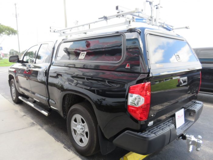 2018 Toyota Tundra with LEER 100RCC, Roof Racks, Side Access, Nerf Bars, Hitch by TopperKING Brandon 813-689-2449 or Clearwater 727-530-9066.