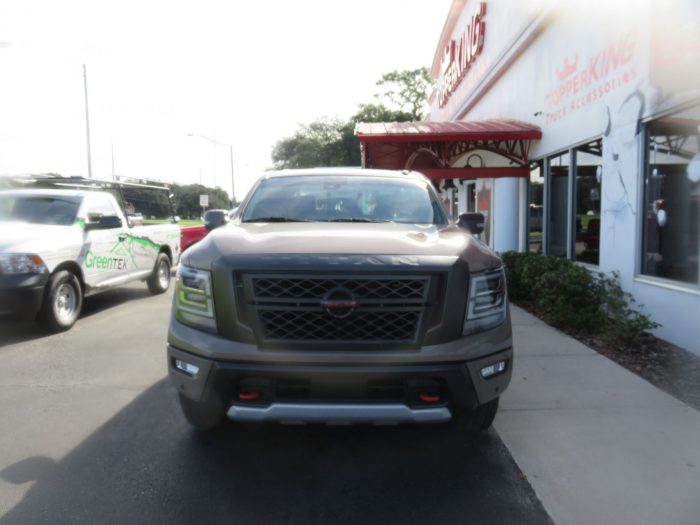 2020 Nissan Titan with LEER 700, Nerf Bars, Tint, Hitch by TopperKING Brandon 813-689-2449 or Clearwater FL 727-530-9066. Call today!