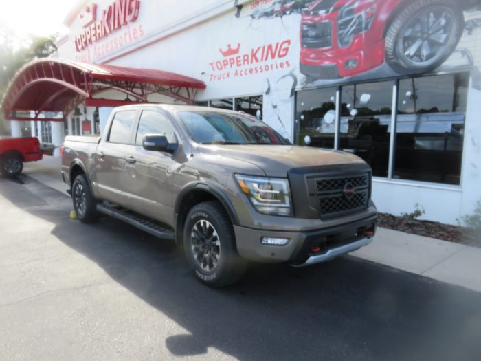 2020 Nissan Titan with LEER 700, Nerf Bars, Tint, Hitch by TopperKING Brandon 813-689-2449 or Clearwater FL 727-530-9066. Call today!