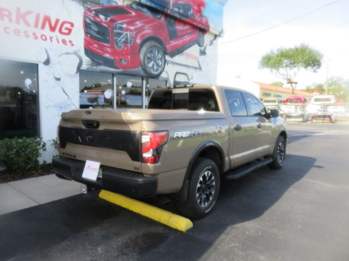 2020 Nissan Titan with LEER 700, Nerf Bars, Tint, Hitch by TopperKING Brandon 813-689-2449 or Clearwater FL 727-530-9066. Call today!