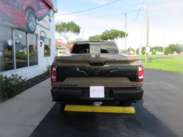 2020 Nissan Titan with LEER 700, Nerf Bars, Tint, Hitch by TopperKING Brandon 813-689-2449 or Clearwater FL 727-530-9066. Call today!