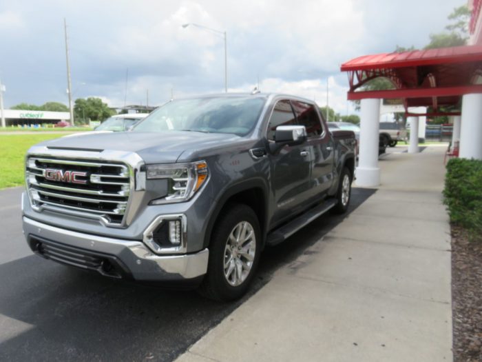 2020 GMC Sierra with LEER 700, Side Steps, Chrome, Tint, Hitch by TopperKING Brandon 813-689-2449 or Clearwater FL 727-530-9066. Call today!