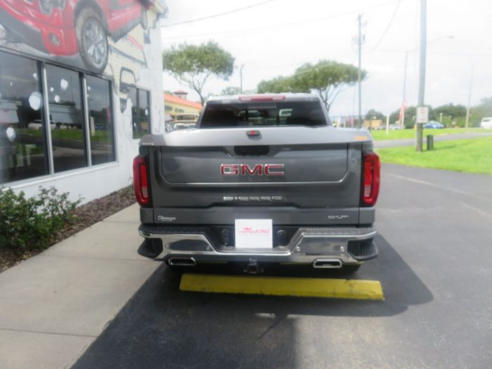 2020 GMC Sierra with LEER 700, Side Steps, Chrome, Tint, Hitch by TopperKING Brandon 813-689-2449 or Clearwater FL 727-530-9066. Call today!