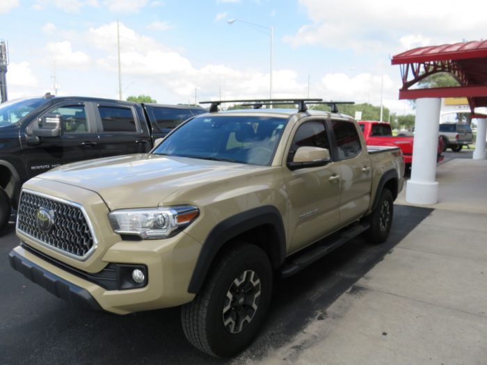 2020 Toyota Tacoma with Yakima Racks, Folding Tonneau, Nerf Bars by TopperKING Brandon 813-689-2449 or Clearwater FL 727-530-9066. Call us!