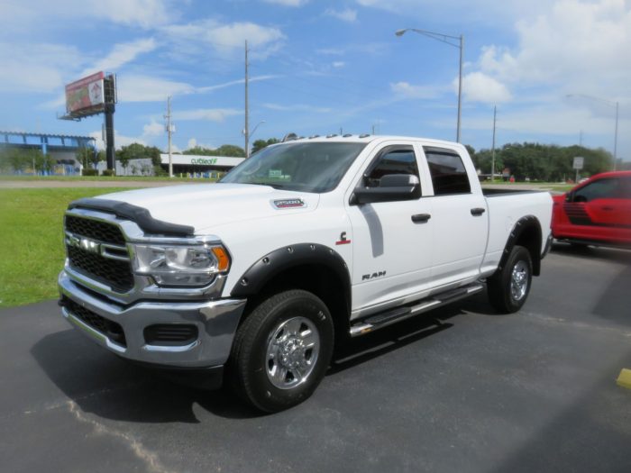 2020 Dodge RAM with Fender Flares, Mud Flaps, Bug Guard and more by TopperKING Brandon 813-689-2449 or Clearwater FL 727-530-9066. Call today!