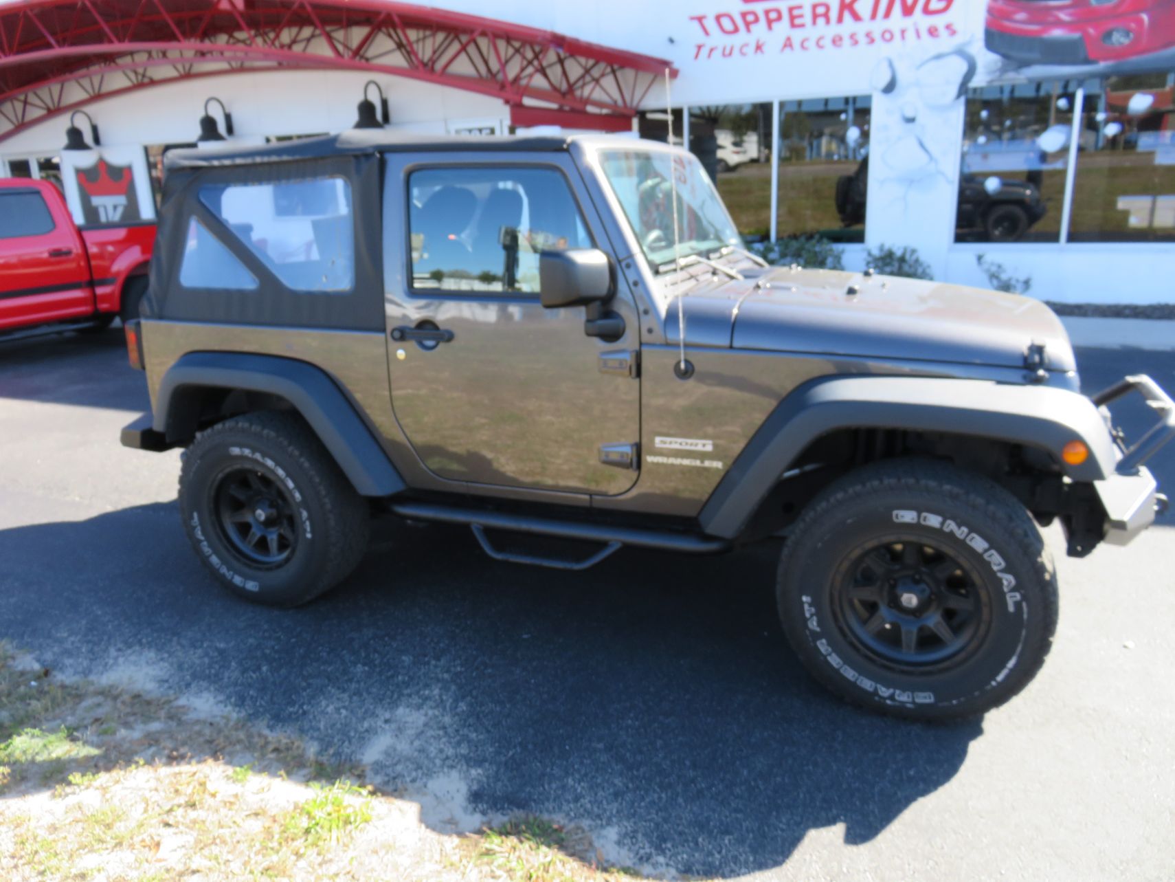 2014 Jeep Wrangler with Black Out Side Steps, Front/Rear Bumpers, Fender Flares. Call TopperKING Brandon 813-689-2449 Clearwater 727-530-9066