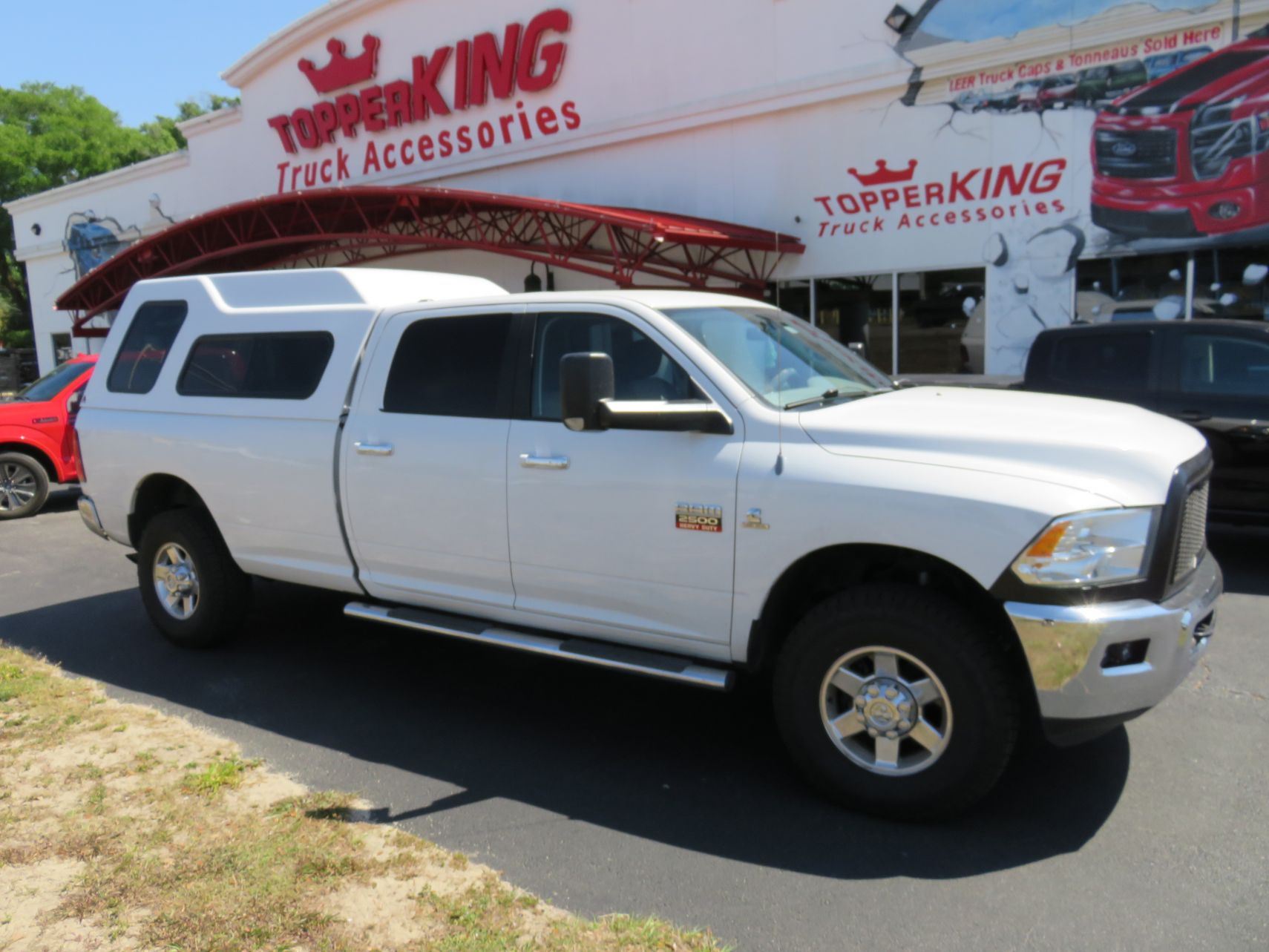 2012 Dodge RAM with LEER 122, Nerf bars, Windoor, Tint, Hitch by TopperKING Brandon 813-689-2449 or Clearwater FL 727-530-9066. Call Today!