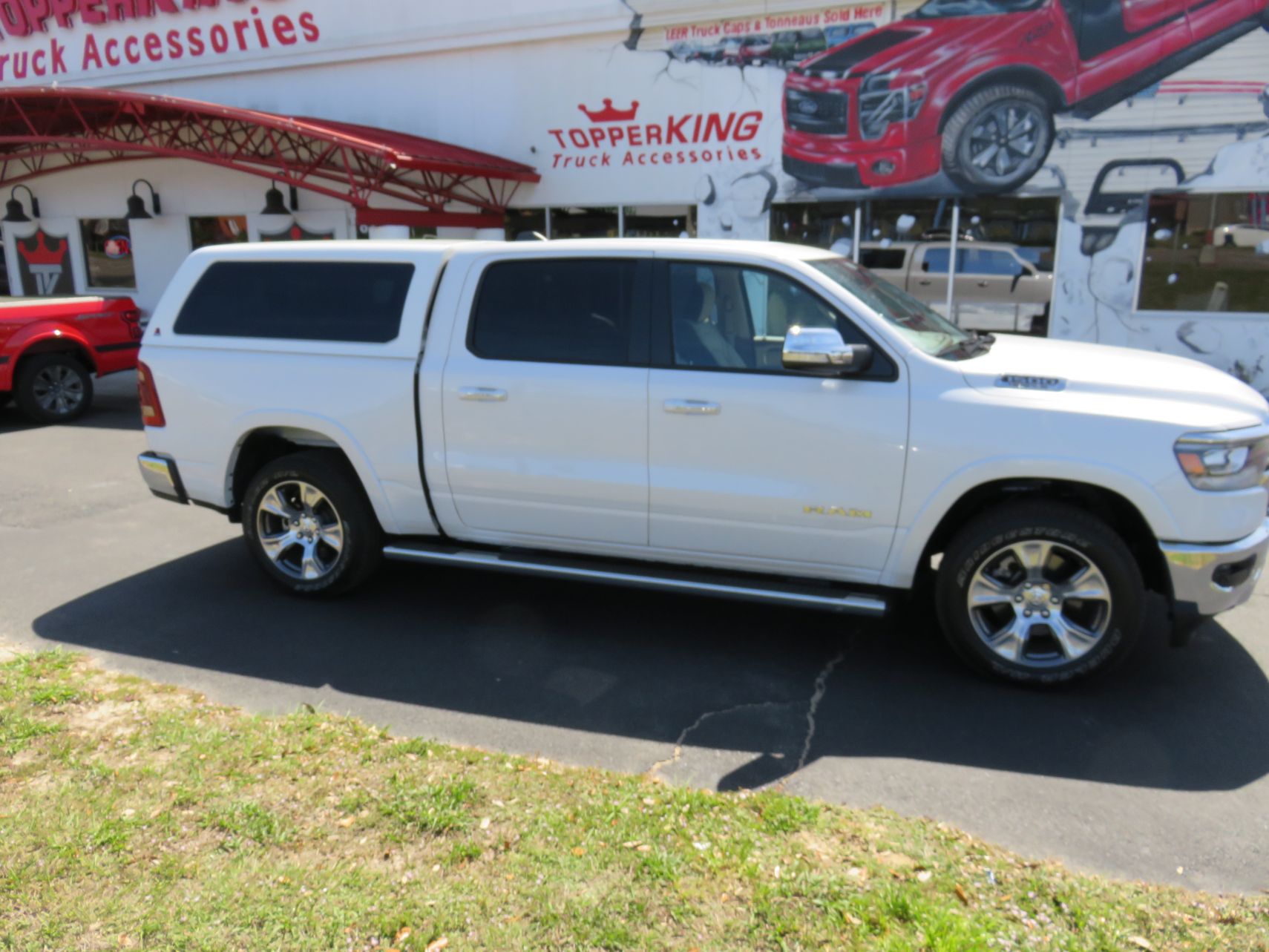 2020 Dodge RAM with LEER 100XQ, Side Steps, Chrome, Tint, Hitch by TopperKING Brandon 813-689-2449 or Clearwater FL 727-530-9066. Call today!