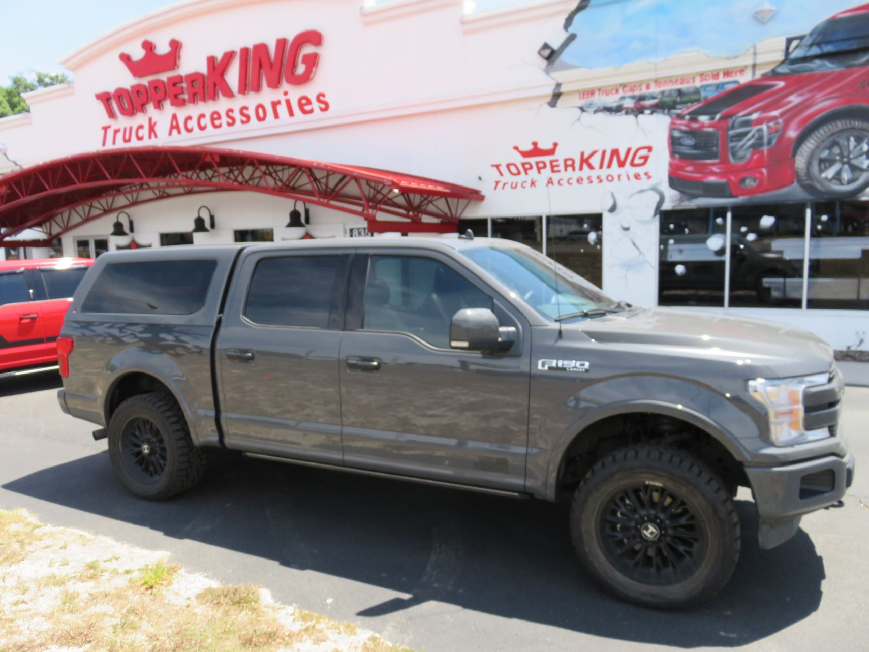 2020 Ford F150 with LEER 100XQ, Graphics, Hitch, Tint by TopperKING Brandon 813-689-2449 or Clearwater FL 727-530-9066. Call today to start!