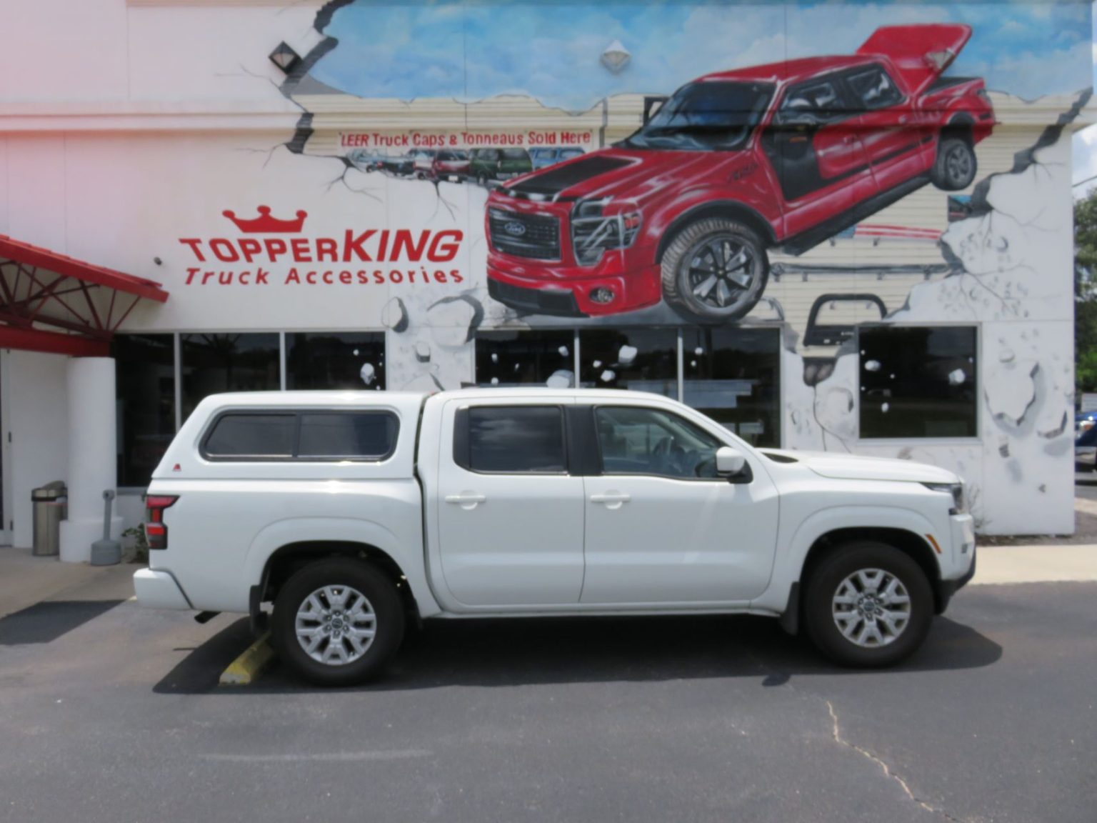 2022 white Nissan Frontier with LEER 100XR TopperKING TopperKING